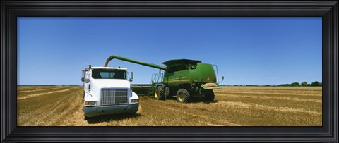 Framed Combine in a wheat field, Kearney County, Nebraska, USA Print