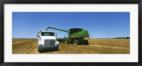 Framed Combine in a wheat field, Kearney County, Nebraska, USA Print