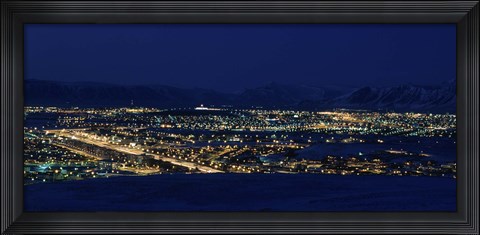 Framed High angle view of city lit up at night, Reykjavik, Iceland Print