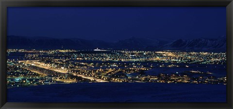 Framed High angle view of city lit up at night, Reykjavik, Iceland Print