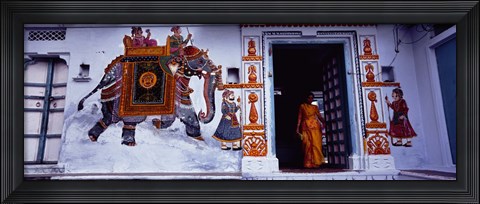 Framed Young woman standing at the door, Udaipur, Rajasthan, India Print