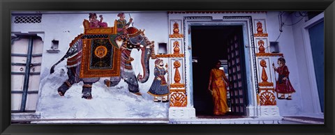 Framed Young woman standing at the door, Udaipur, Rajasthan, India Print