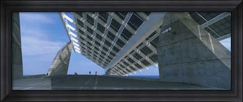 Framed Four people under a structure, Barcelona, Catalonia, Spain Print