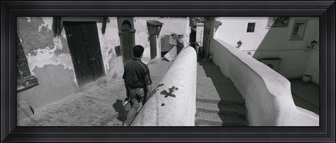 Framed Rear view of a man walking in front of a building, Casaba, Algiers, Algeria Print