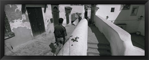 Framed Rear view of a man walking in front of a building, Casaba, Algiers, Algeria Print