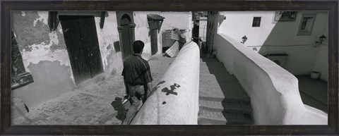 Framed Rear view of a man walking in front of a building, Casaba, Algiers, Algeria Print