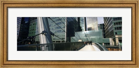 Framed Bridge in front of buildings, Canary Wharf, London, England Print