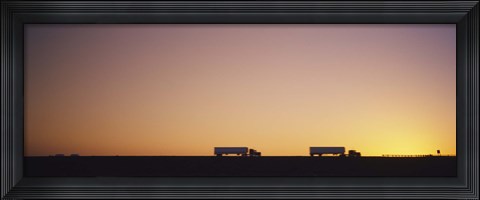 Framed Silhouette of two trucks moving on a highway, Interstate 5, California, USA Print