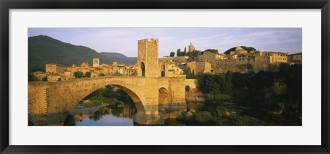 Framed Arch bridge across a river in front of a city, Besalu, Catalonia, Spain Print
