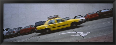 Framed Taxi running on the road, San Francisco, California, USA Print