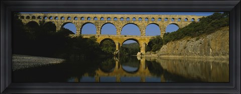 Framed Reflection of an arch bridge in a river, Pont Du Gard, France Print