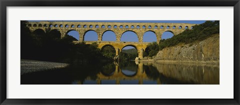 Framed Reflection of an arch bridge in a river, Pont Du Gard, France Print