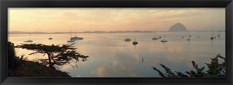 Framed Boats in a bay with Morro Rock in the distance, Morro Bay, San Luis Obispo, California, USA Print