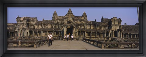 Framed Tourists walking in front of an old temple, Angkor Wat, Siem Reap, Cambodia Print
