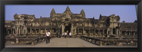 Framed Tourists walking in front of an old temple, Angkor Wat, Siem Reap, Cambodia Print