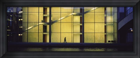 Framed Silhouette of a person walking in front of a building, Paul Lobe Haus, Berlin, Germany Print