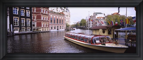 Framed Tourboat in a channel, Amsterdam, Netherlands Print
