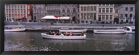 Framed High angle view of tourboats in a river, Leie River, Graslei, Ghent, Belgium Print