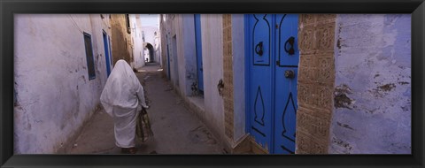 Framed Rear view of a woman walking on the street, Medina, Kairwan, Tunisia Print