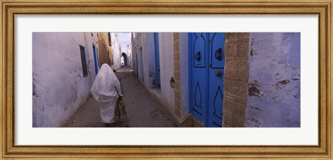 Framed Rear view of a woman walking on the street, Medina, Kairwan, Tunisia Print