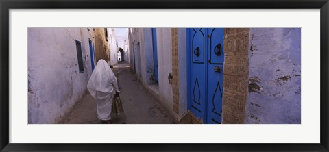 Framed Rear view of a woman walking on the street, Medina, Kairwan, Tunisia Print