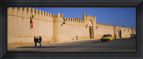 Framed Car on a road in front of a fortified wall, Medina, Kairwan, Tunisia Print