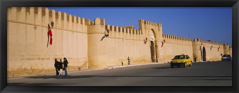 Framed Car on a road in front of a fortified wall, Medina, Kairwan, Tunisia Print