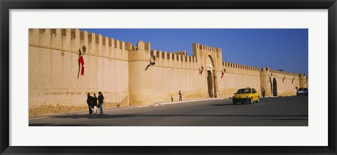 Framed Car on a road in front of a fortified wall, Medina, Kairwan, Tunisia Print