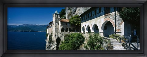 Framed Walkway along a building at a lake, Santa Caterina del Sasso, Lake Maggiore, Piedmont, Italy Print
