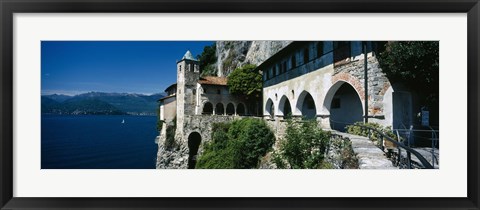 Framed Walkway along a building at a lake, Santa Caterina del Sasso, Lake Maggiore, Piedmont, Italy Print