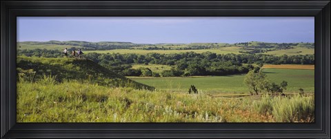 Framed Three mountain bikers on a hill, Kansas, USA Print