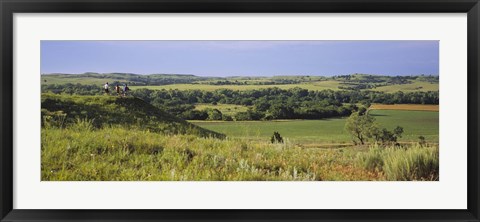 Framed Three mountain bikers on a hill, Kansas, USA Print