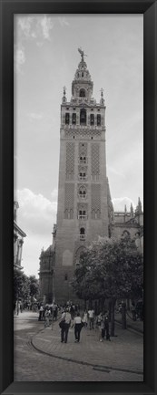 Framed Group of people walking near a church, La Giralda, Seville Cathedral, Seville, Seville Province, Andalusia, Spain Print