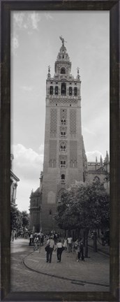 Framed Group of people walking near a church, La Giralda, Seville Cathedral, Seville, Seville Province, Andalusia, Spain Print