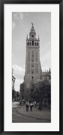 Framed Group of people walking near a church, La Giralda, Seville Cathedral, Seville, Seville Province, Andalusia, Spain Print