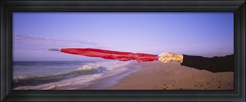 Framed Close-up of a woman&#39;s hand pointing with a red umbrella, Point Reyes National Seashore, California, USA Print