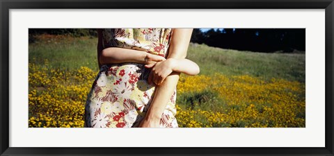 Framed Mid section view of a girl hugging her mother in a field, Marin County, California, USA Print