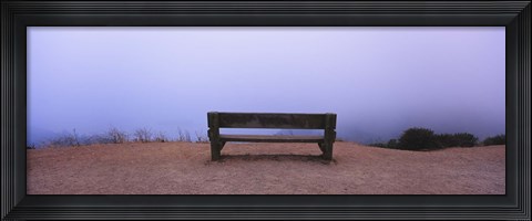 Framed Empty bench in a parking lot, California, USA Print