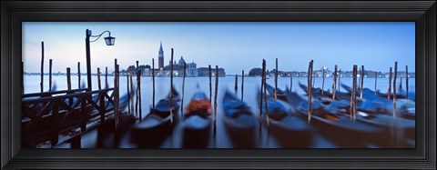 Framed Row of gondolas moored near a jetty, Venice, Italy Print