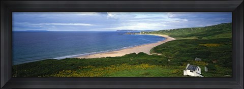 Framed Birds-eye view of sea, white stone cottage, Northern Ireland. Print