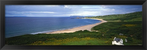 Framed Birds-eye view of sea, white stone cottage, Northern Ireland. Print