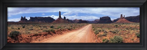 Framed Dirt road through desert landscape with sandstone formations, Utah. Print