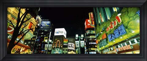 Framed Low angle view of buildings lit up at night, Shinjuku Ward, Tokyo Prefecture, Kanto Region, Japan Print