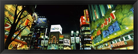 Framed Low angle view of buildings lit up at night, Shinjuku Ward, Tokyo Prefecture, Kanto Region, Japan Print