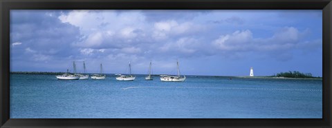 Framed Boats in the sea with a lighthouse in the background, Nassau Harbour Lighthouse, Nassau, Bahamas Print