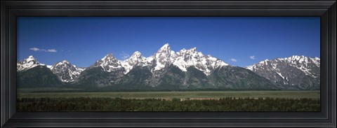 Framed Trees in a forest with mountains in the background, Teton Point Turnout, Teton Range, Grand Teton National Park, Wyoming, USA Print