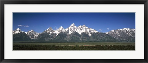 Framed Trees in a forest with mountains in the background, Teton Point Turnout, Teton Range, Grand Teton National Park, Wyoming, USA Print