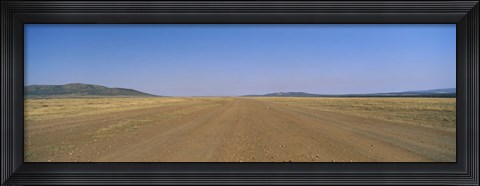 Framed Dirt road passing through a landscape, Masai Mara National Reserve, Great Rift Valley, Kenya Print