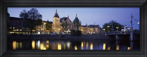 Framed Reflection of a railway station in water, Amsterdam Central Station, Amsterdam, Netherlands Print