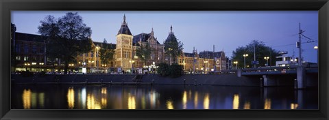 Framed Reflection of a railway station in water, Amsterdam Central Station, Amsterdam, Netherlands Print